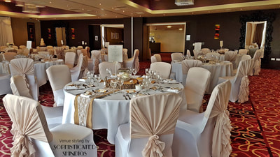 Hallmark Hotel dressed with nude chair hoods, and natural wood and hessian table dressing.